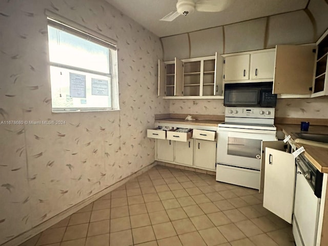 kitchen with light tile patterned floors, white appliances, and ceiling fan