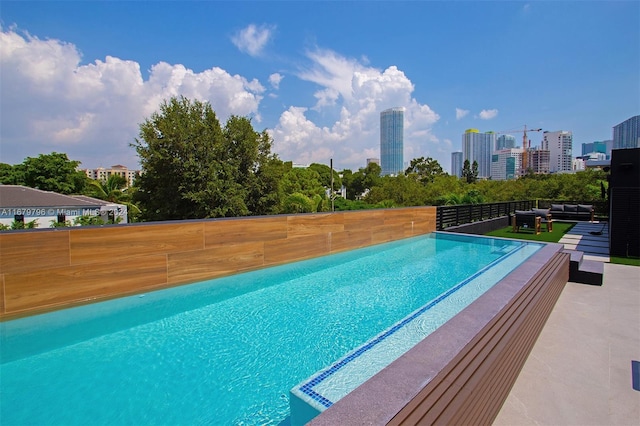 420 SW 15th Rd, Miami, FL 33129 - outdoor pool with an outdoor hangout area, a skyline view, and a patio