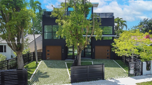 420 SW 15th Rd, Miami, FL 33129 - view of front facade with a garage and stucco siding