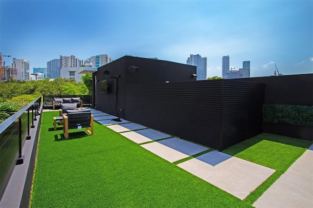 420 SW 15th Rd, Miami, FL 33129 - view of green lawn with a view of skyline and an outdoor hangout area