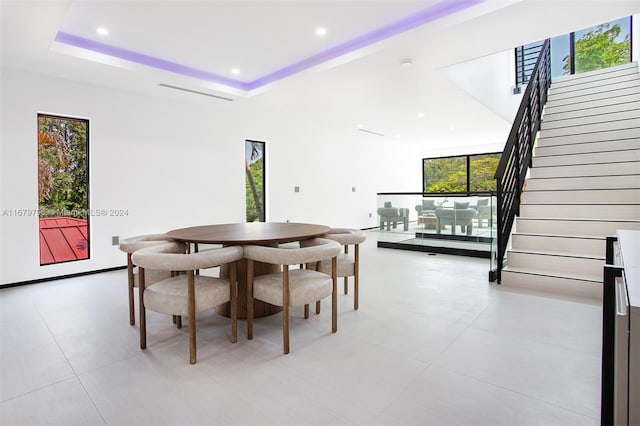 dining space featuring a tray ceiling