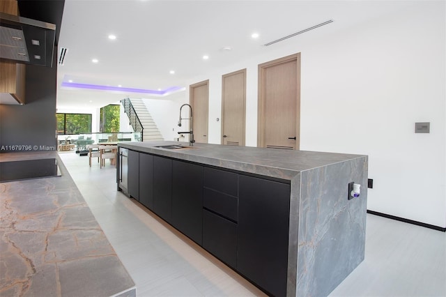 420 SW 15th Rd, Miami, FL 33129 - kitchen with modern cabinets, dark cabinets, recessed lighting, black electric cooktop, and a spacious island