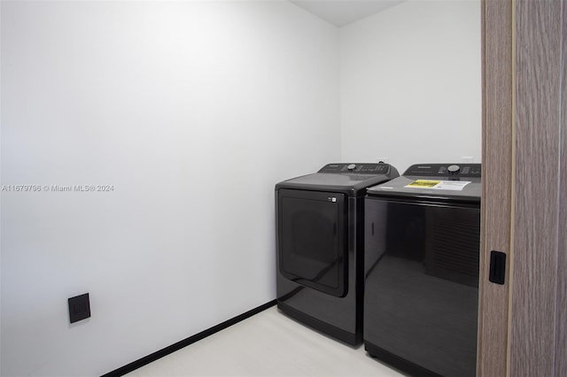 washroom featuring washer and dryer