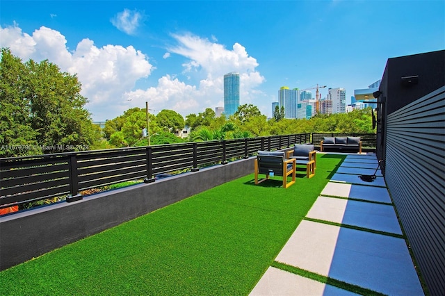 420 SW 15th Rd, Miami, FL 33129 - view of yard featuring a view of skyline, a balcony, and an outdoor hangout area