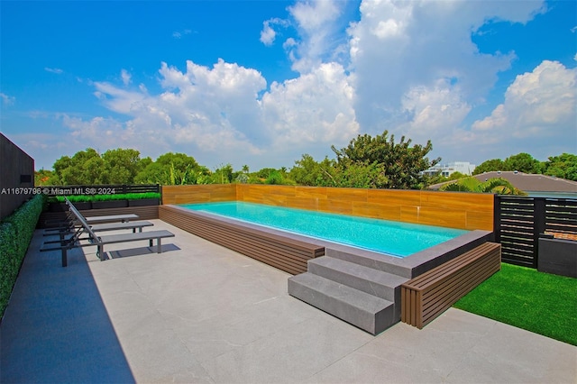 view of pool with a patio area