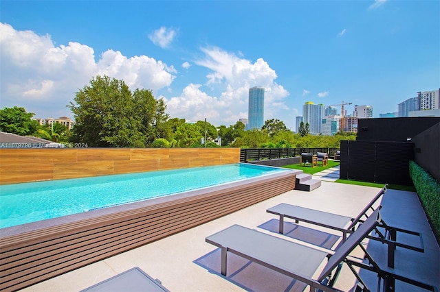 view of swimming pool with a patio