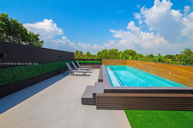 view of pool with a patio area