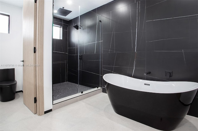 420 SW 15th Rd, Miami, FL 33129 - bathroom with a stall shower, a freestanding tub, and tile walls