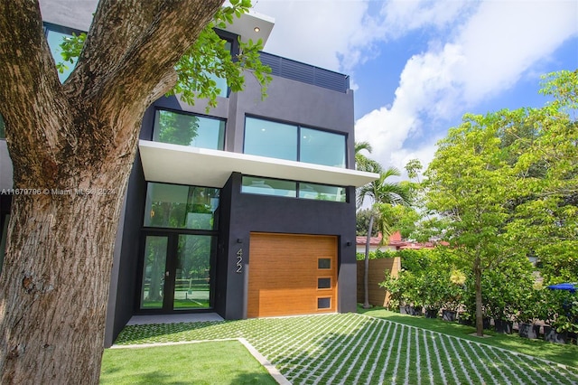 rear view of house featuring a lawn