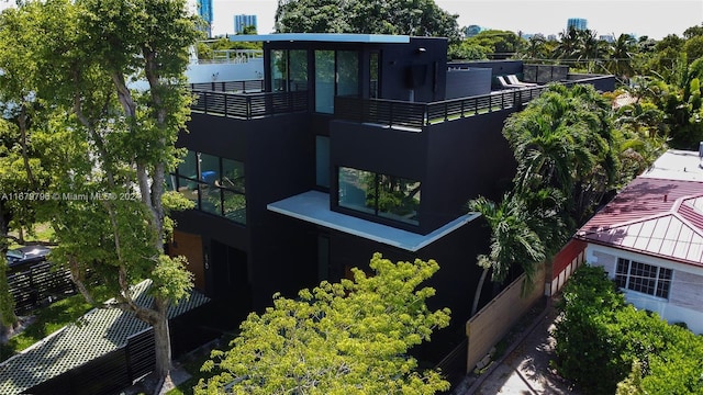 420 SW 15th Rd, Miami, FL 33129 - back of house with a balcony and stucco siding