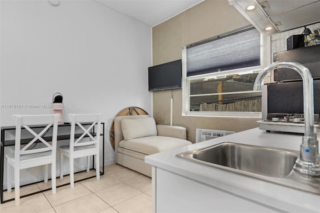 kitchen featuring sink and light tile patterned floors