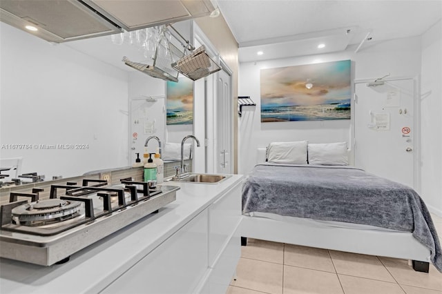 tiled bedroom featuring sink