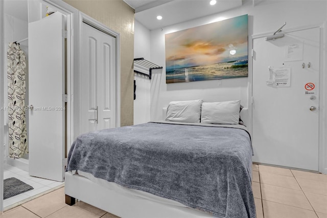 bedroom featuring light tile patterned floors