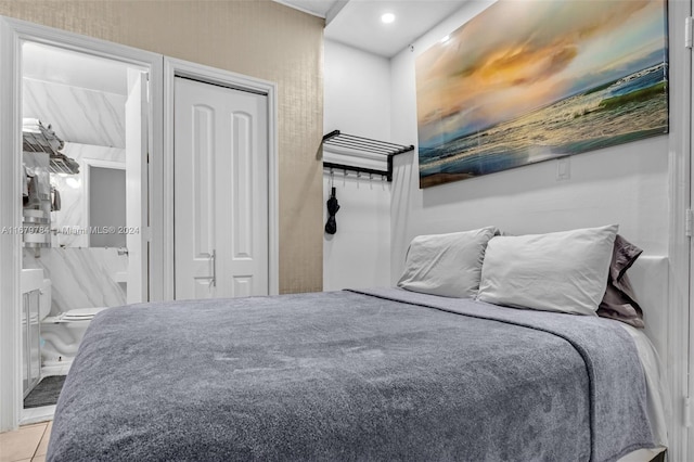 tiled bedroom with ensuite bath