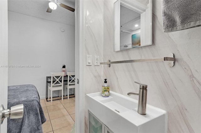 bathroom with tile patterned floors, sink, and ceiling fan