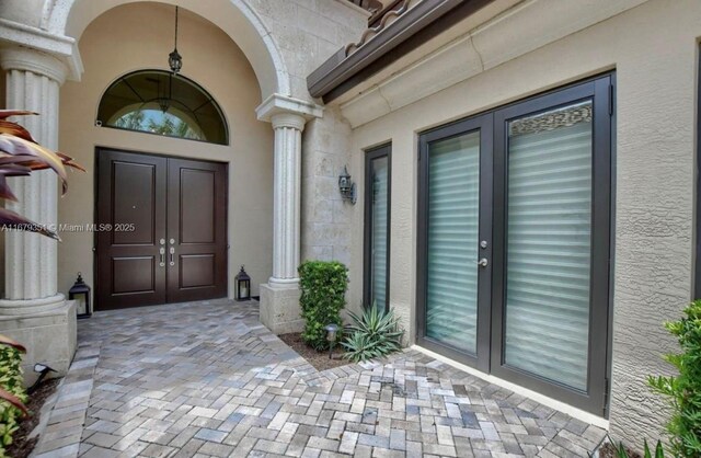 entrance to property featuring french doors