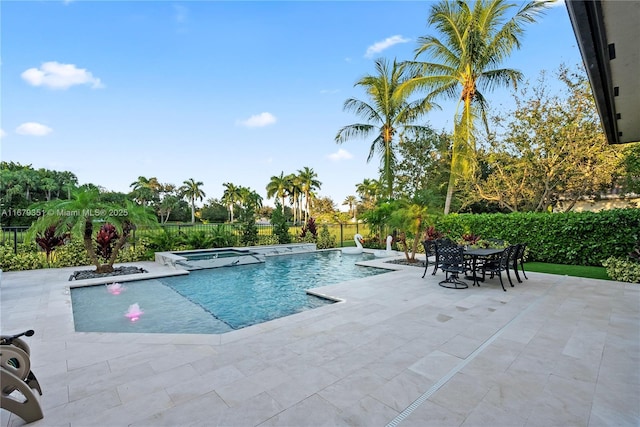 view of pool featuring an in ground hot tub, a patio area, and pool water feature