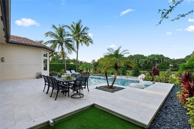 view of swimming pool featuring a patio area