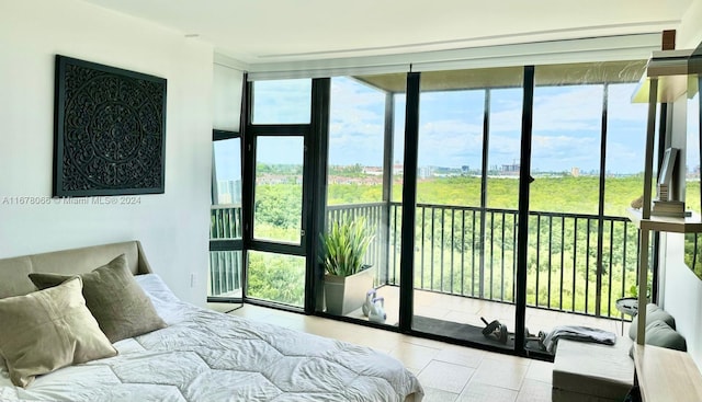 bedroom featuring a wall of windows, access to exterior, and light tile patterned floors