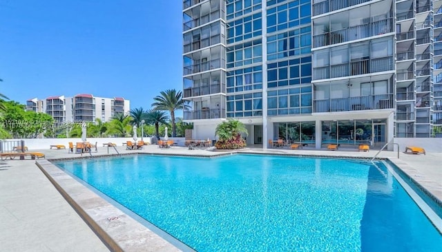 view of swimming pool with a patio