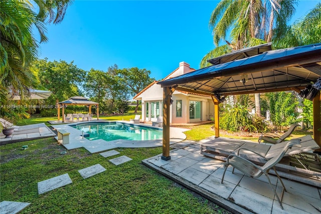 view of pool featuring a gazebo, a yard, and a patio area