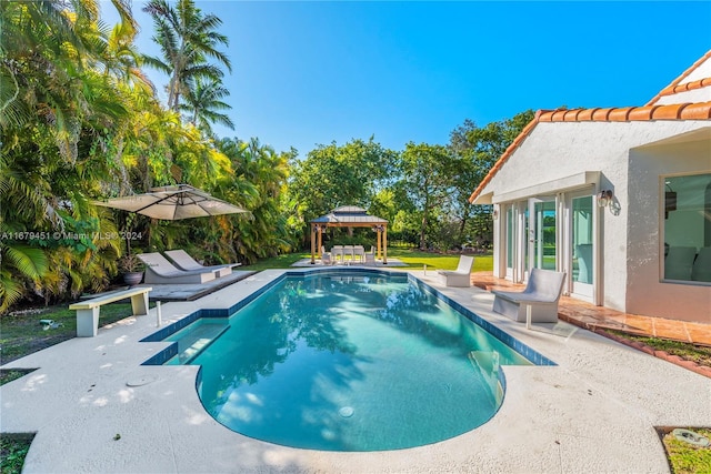 view of pool featuring a patio and a gazebo