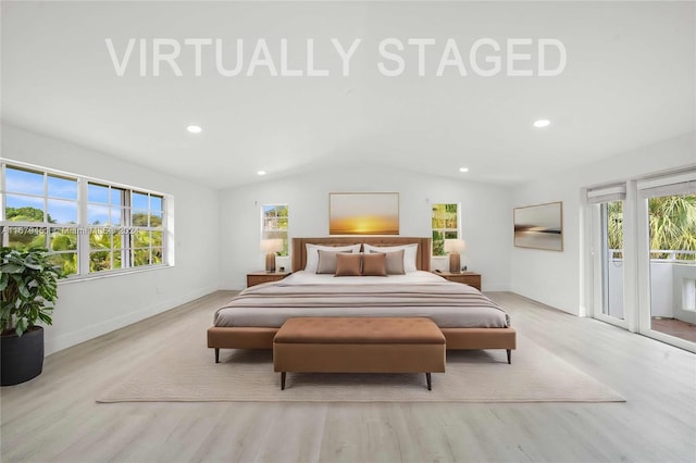 bedroom with light hardwood / wood-style floors, lofted ceiling, and multiple windows