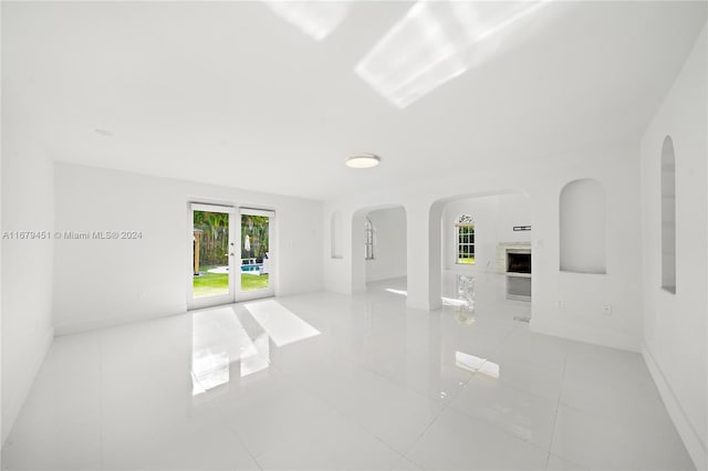 tiled spare room with french doors