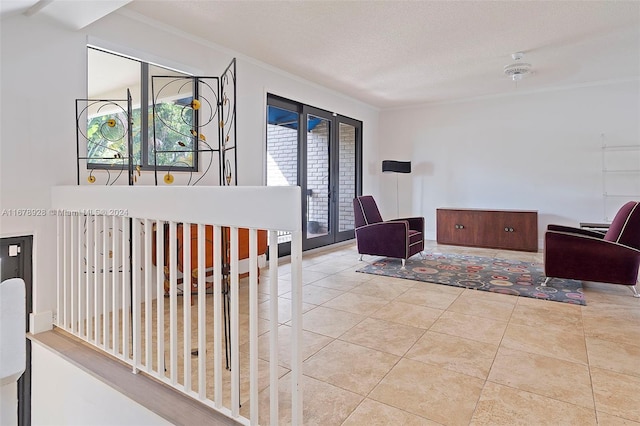 interior space with crown molding, light tile patterned flooring, and a textured ceiling