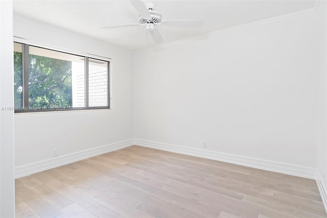 spare room with ceiling fan, crown molding, a textured ceiling, and light wood-type flooring