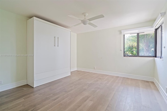 unfurnished bedroom with light hardwood / wood-style flooring and ceiling fan