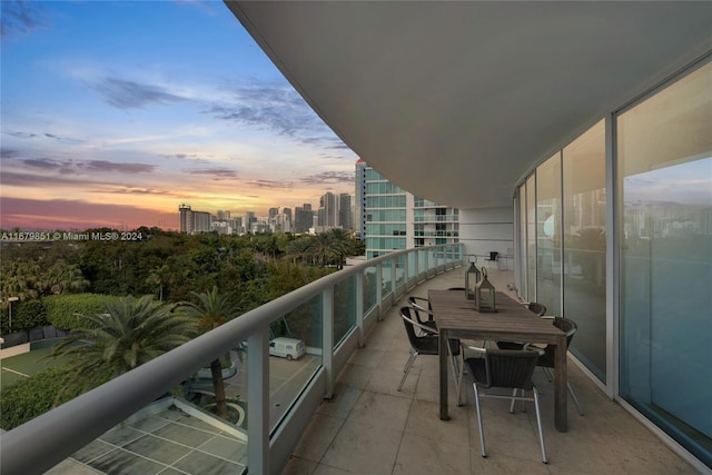 view of balcony at dusk