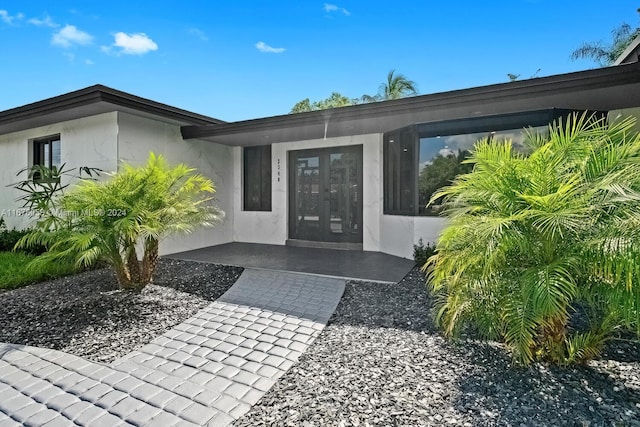 property entrance featuring french doors