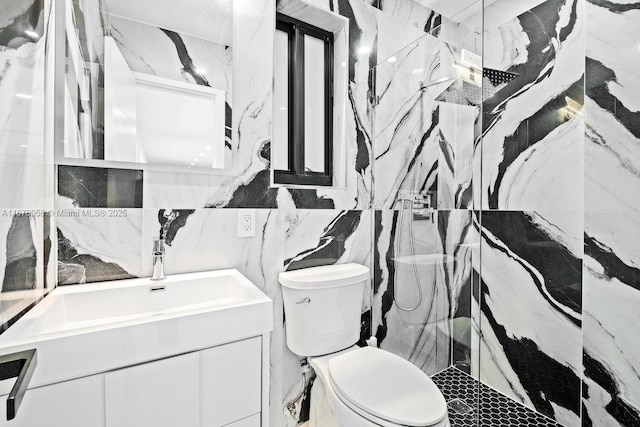 2340 NE 194th St, Miami, FL 33180 - bathroom featuring a marble finish shower, toilet, tile walls, and vanity