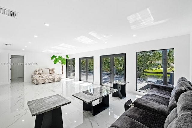 2340 NE 194th St, Miami, FL 33180 - living area featuring french doors, recessed lighting, and light marble finish flooring