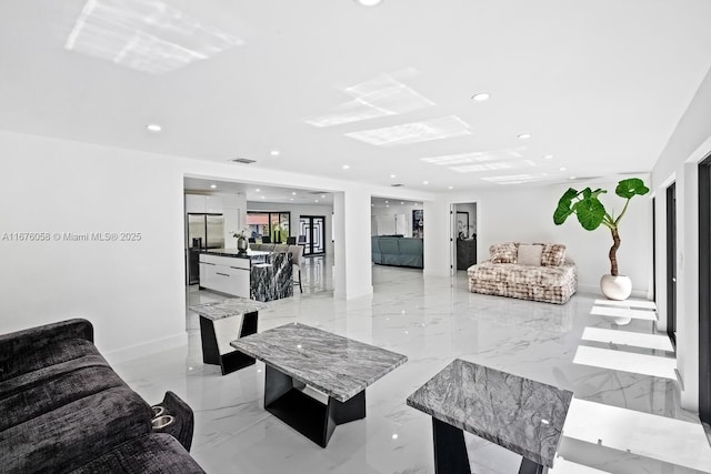 2340 NE 194th St, Miami, FL 33180 - living area with recessed lighting, light marble finish floors, and baseboards