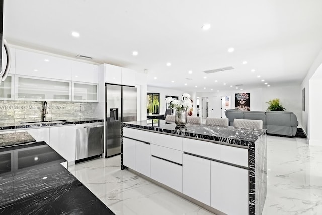 2340 NE 194th St, Miami, FL 33180 - kitchen with appliances with stainless steel finishes, light marble finish floors, a sink, modern cabinets, and recessed lighting