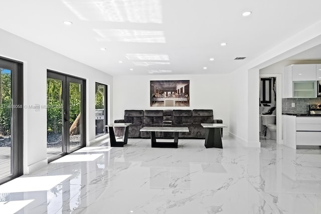 2340 NE 194th St, Miami, FL 33180 - living room featuring recessed lighting, baseboards, light marble finish flooring, and french doors