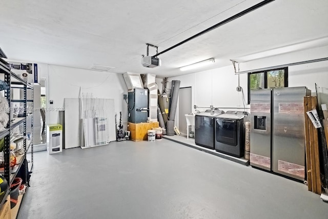 2340 NE 194th St, Miami, FL 33180 - garage with washer and dryer, a garage door opener, stainless steel fridge with ice dispenser, and heating unit