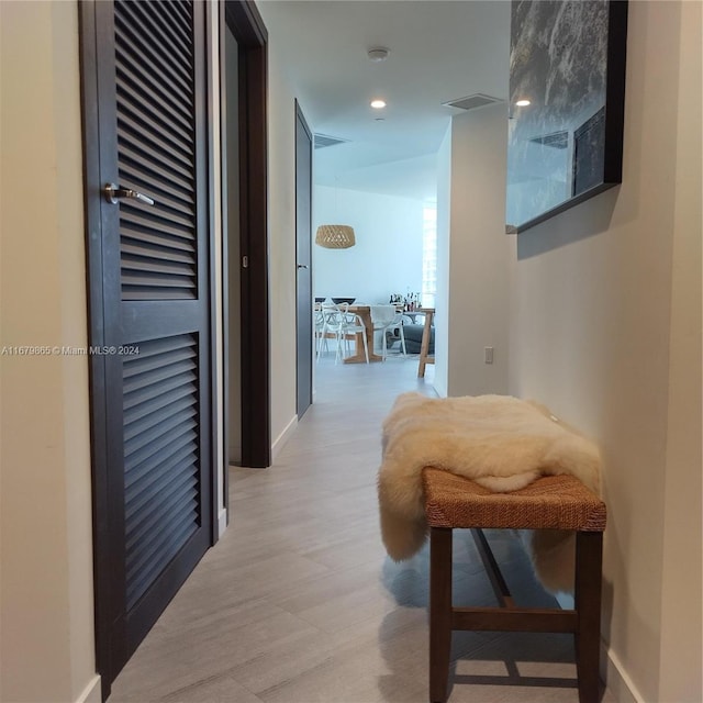 1000 Brickell Plz Unit 3112, Miami, FL 33131 - corridor with light wood-style flooring, baseboards, and recessed lighting