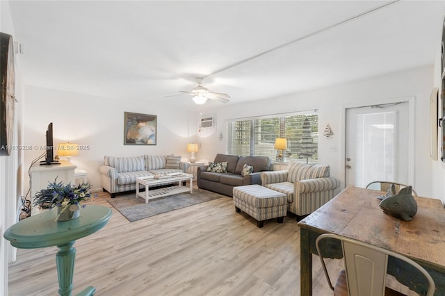 living room featuring ceiling fan and light wood-type flooring