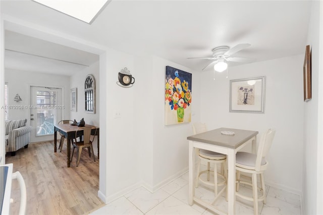 dining area with ceiling fan