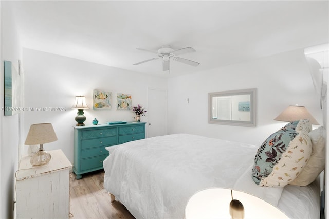 bedroom featuring ceiling fan and light hardwood / wood-style flooring