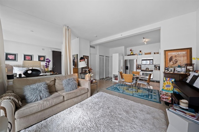 living room featuring concrete flooring