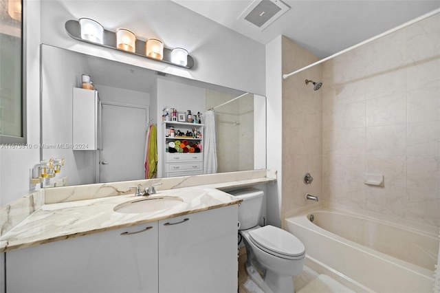 full bathroom featuring vanity, shower / bath combo with shower curtain, and toilet