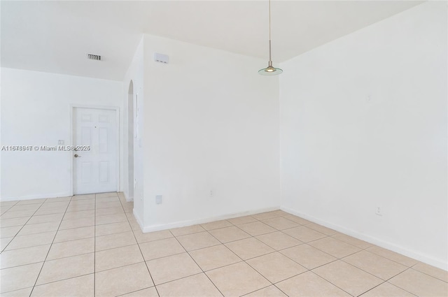 unfurnished room featuring light tile patterned flooring