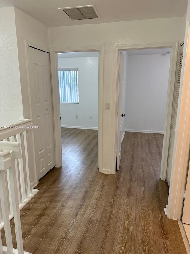 hallway featuring dark wood-type flooring