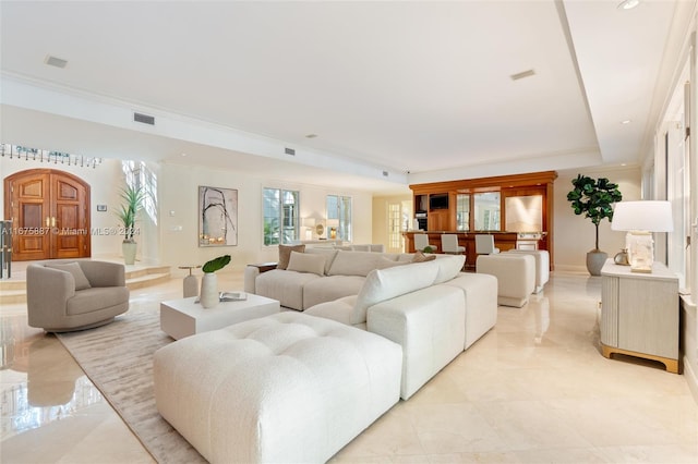 living room with ornamental molding