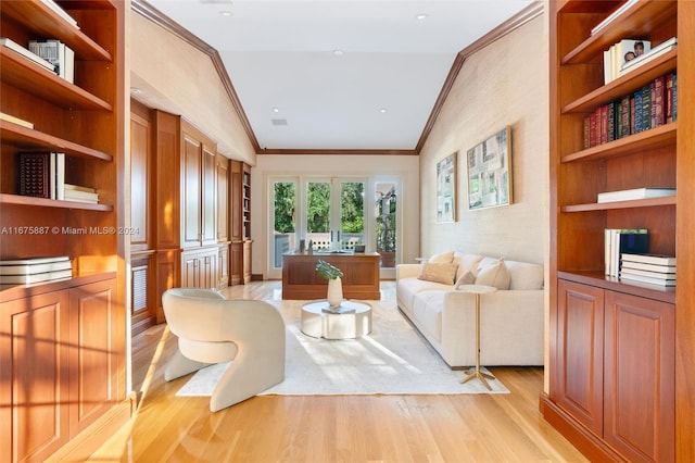 living room with light hardwood / wood-style flooring, lofted ceiling, and crown molding