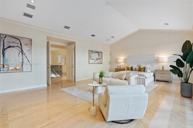 bedroom with light hardwood / wood-style floors, crown molding, and lofted ceiling